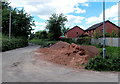 Heap of sand and gravel on the corner of Garthalan Drive and Station Road, Caldicot