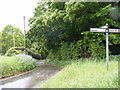 TM1238 : Church Road to Bentley Church & roadsign by Geographer