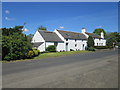 The two lower buildings are former farm buildings and a stable