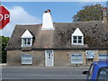 Junction and house with crooked chimney