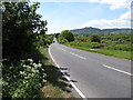 J0316 : View westwards along the B113 (Newry Road) by Eric Jones