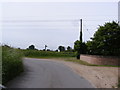 TM1238 : Road at Malting Farm & footpath by Geographer