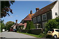 Cottages, a phone box and a post box in Burpham