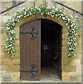 Wedding flowers at the entrance to Alnwick Parish Church