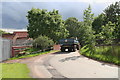 Tractor and trailer on the bridge by Castle Farm