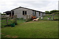 Paddock and stable by the footpath