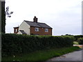 TM3586 : Grove Farm Cottages by Geographer