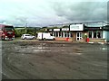 Muddy carpark of the roadside cafe