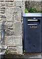 Benchmark on stone hut in playground, Moor Lane