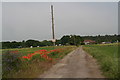 TF1288 : Glebe Farm: poppies, vetch and a wind pump by Chris