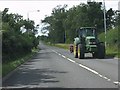 Tractor on the A47 at Woodlands