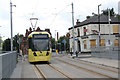 Tram leaving Holt Town stop