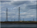 TQ9168 : Pylons carrying power over the Swale by Chris Whippet