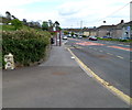 Bus stop and an old milepost, Burry Port