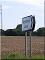 TG2804 : Woolers Lane sign by Geographer