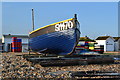 Fishing boat drawn up on beach