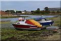 Boats on the mud in Workhouse Lake, Gosport