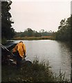 TF9801 : Fishing in the rain at Scoulton Mere by David Leeming