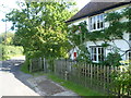 Cottage with a post box at Acrise