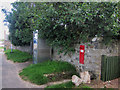 NU2424 : Post box and public telephone box, Low Newton-by-the-Sea by Graham Robson