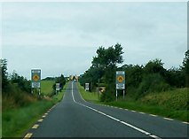 N2165 : Warning of traffic calming measures and of a no-overtaking zone at the approach to Carrickboy by Eric Jones