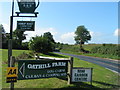 The B3165 heading south past the entrance to Oathill farm