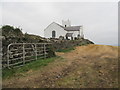 Ballintoy Parish Church viewed from the road descending towards the harbour