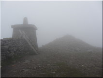 J3527 : Slieve Donard trig point and summit cairn in the mist by Gareth James