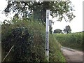 A damaged signpost at Blakewell Cross