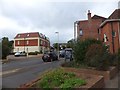 Cars parked outside shops in Littleham