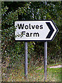 TM0443 : Wolves Farm sign by Geographer