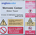 TL9840 : Sign on Watsons Corner Water Tower by Geographer