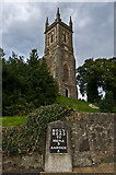 SH5571 : St Mary's Church and milestone by Ian Capper
