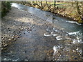 Afon Afan flows away from a footbridge in Cwmavon 