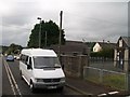 D0605 : A school bus stopped at the level crossing on Station Road, Cullybackey by Eric Jones
