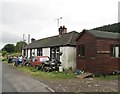 NX9791 : A cottage with motorbikes at Burnfoot by Ann Cook