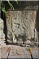 Benchmark on archway entrance to church from Bath Street