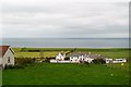 A modern-day clachan of houses west of Ballintoy Parish Church