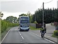 TR1155 : Bus and Cyclist on Ashford Road by David Dixon