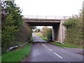 Minor road with the A42 crossing above