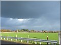 Louring skies with a hint of a rainbow over Treales