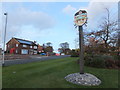 Village sign and red telephone box, Weeton