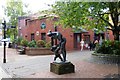 A sculpture in front of the library