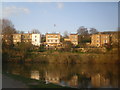 Houses alongside canal at dusk