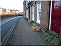 TF4509 : Sandbags by the front doors on South Brink, Wisbech by Richard Humphrey