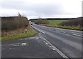 The A697 passes the turn off for Heron