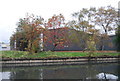 Trees and factory by the canal