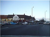 TQ3292 : Shops on the Great Cambridge Road roundabout by David Howard