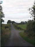 H7401 : Junction with private farm road on the minor road linking the R165 and R162 by Eric Jones