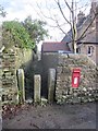 A delightful stone stile and postbox at Upper Elkstone